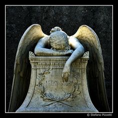 an angel statue resting its head on top of a grave with the words heaven story written below it