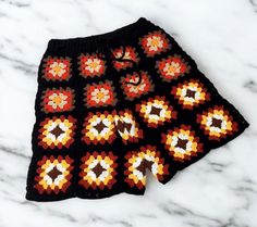 _Product information Granny Square Shorts: Colorful Men's Ethnic Shorts Discover the Granny Square Shorts designed to infuse vibrancy into your style. These shorts adorned with colorful and ethnic touches blend comfort and style seamlessly. Handcrafted with meticulous care, these unisex crochet shorts offer a lightweight and breathable construction to keep you cool even in warm weather. Crafted from soft and durable materials, Granny Square Shorts are built to last, making them an ideal choice f Handmade Casual Bottoms For Vacation, Granny Square Shorts, Unisex Crochet, Crochet Men, Shorts Crochet, Mens Beach Shorts, Patchwork Shorts, Crochet Shorts, Crochet Things