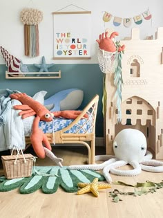 a child's room with toys and decor on the floor, including stuffed animals