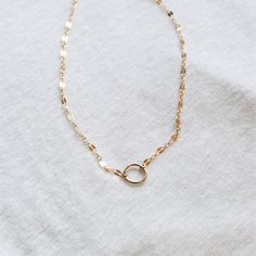 This mini eternity necklace is edgy and chic, wear it in gold or silver. A reminder that some things do last forever! D E T A I L S -10mm open circle -14kt Gold-Filled or sterling silver chain & circle. -Choose fancy or bar link chain LENGTH -Measures 16 inches with a 1 1/2 inch extender for a total length of 17 1/2 inches. -You can wear this at 16 inches or 17 1/2 inches. ∙ EXTRA LOVE ∙ Crafted and curated just for you in the desert of our Arizona studio. All of our jewelry comes gift packa Everyday Delicate Infinity Chain Necklace, Minimalist Gold Infinity Necklace, Minimalist Infinity Gold Necklace, Minimalist Infinity Necklace With Delicate Chain, Minimalist 14k Gold Filled Necklace With Lobster Clasp, Dainty Infinity Necklace For Everyday Wear, Dainty Infinity Necklace For Everyday, Minimalist Choker With Lobster Clasp As Gift, Minimalist 14k Gold Filled Choker