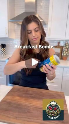 a woman is pouring something into a can