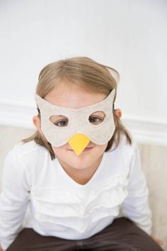 The felt bird mask is available in FIVE colors. Please select the color and size of your choice at checkout. Custom designs, colors and sizes are available upon request, just ask! The mask is top stitched with two layers of felt for quality and durability. It stays securely in place with a 1/4" black elastic band around the back. The mask is approximately 7" wide at the eyes and made to fit a child's face. Measure your child's head (around where the mask would go) for best fit. Small - 17" aroun Pigeon Mask, Swan Mask, Raven Mask, Bird Mask, Owl Mask, Bird Costume, Bird Masks, Handmade Costumes, Bird Wings