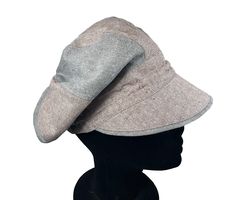 This European, made from Hemp and Organic cotton, features use of color groupings to create a novel and unique look.  The roomy cap can accommodate a full head of hair.   The One-Size styling can be adjusted through an elasticized buckled cording at center back.  This hat fits up to a 24" circumgerence and is fully lined. Follow the measuring instructions. A custom sizing option is available.  Contact the seller to discuss.  Visit  www.etsy.com/ca/shop/DCPDesignsCanada/   to see more products by Slouchy Cap For Outdoor, Slouchy Outdoor Cap, Hat Fits, Textile Industry, Slouchy Hat, Color Grouping, A Novel, Custom Sizing, Caps Hats