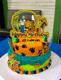 a birthday cake with the simpsons characters on it