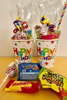 two buckets filled with happy birthday candy and candies