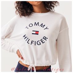 Tommy Hilfiger Caters To Your Sporty Side With The Drawcord Sweatshirt. This Pullover Features Long Sleeves, Crew Neckline, Logo Graphic At The Chest, Drawcord Hem, And A Cropped Fit. Pullover Sweatshirt Crew Neckline Logo Graphic Long Sleeves Drawcord Hem Cropped Length Boxy Fit Model Is Wearing A Small 62% Polyester, 33% Rayon, 5% Spandex Machine Washable New With Tags Tommy Hilfiger Monogram Sweater, Sporty Long Sleeve Tommy Hilfiger Top, Tommy Hilfiger Sporty Long Sleeve Tops, Tommy Hilfiger White Long Sleeve Tops, Tommy Hilfiger Top, Tommy Hilfiger Sweatshirt, Chic Leather, Tommy Hilfiger Outfit, Milan Fashion Weeks