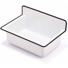 a white square dish with black trim on the edge and bottom, isolated against a white background