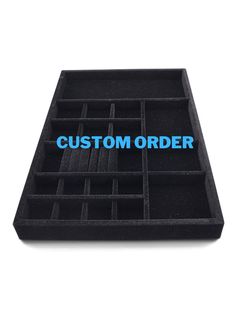 a black foam tray with the words custom order in blue letters on it and an image of