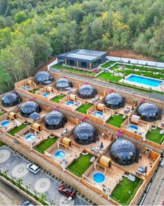 an aerial view of a resort with swimming pool and hot tubs in the middle