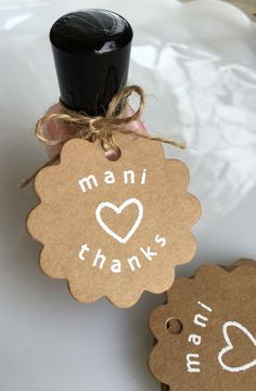 two tags that say manii and thanks