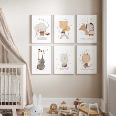 a baby's room with four pictures on the wall and toys in the floor