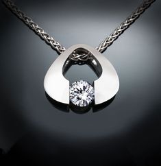 "Cubic Zirconia Necklace - Argentium Silver - 3423 - Argentium Chain Included - Ready to ship! ( IMPORTANT - PLEASE READ 1. AND 2 BELOW ) 1.) Included in the price is an Argentium silver chain appropriate for the pendant chosen. You can choose from 16\", 18\" or 20\" length at checkout. 2.) PLEASE LOOK AT THE MEASUREMENTS CAREFULLY. Some photos have been enlarged to show detail, while others have been minimized to fit the frame. Actual size cannot be determined from the photographs. MEASUREMENTS Yucca Valley, Sapphire Necklace Pendants, Pretty Jewelry Necklaces, Blue Sapphire Necklace, Tension Setting, Zirconia Necklace, Cubic Zirconia Necklace, Cz Necklace, Custom Ring Designs