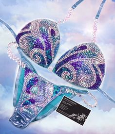 two bras with blue and purple designs on them