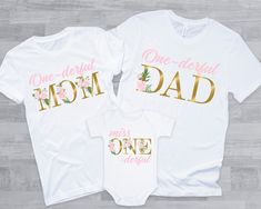 two shirts that say, one - derful mom and one - dad with flowers on them