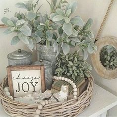 a basket filled with plants sitting on top of a table