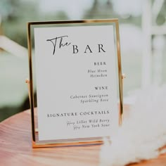 a menu card sitting on top of a wooden table