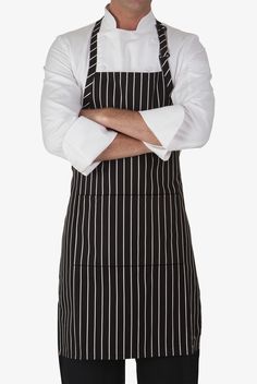 a man wearing an apron with his arms crossed