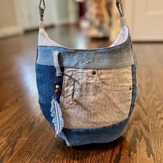 a purse made out of old jeans on the floor