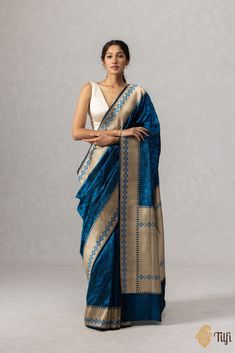 "\u00a0\nSteeped in history,\u00a0thoughtfully designed for the modern muse. This is a gorgeous and chic saree with a\u00a0contemporary patola inspired, pixelated\u00a0pattern and a rich dose of zari.\u00a0\n\n\n\n\n Color\u00a0- A\u00a0striking shade of\u00a0Blue\n\n\n Technique\u00a0-\u00a0 The\u00a0finest Tanchoi weaving technique, which employs one or more warps and multiple coloured wefts to produce a self-design that covers the body of the saree.\u00a0\n\n\n Fabric\u00a0-\u00a0Soft as butt Cotton Silk Saree With Woven Motifs, Tussar Silk Saree With Woven Motifs, Slub Silk Saree With Woven Motifs For Wedding, Chanderi Pre-draped Saree With Woven Motifs, Elegant Blue Handloom Pre-draped Saree, Formal Handloom Silk Pre-draped Saree, Diwali Pre-draped Saree With Woven Motifs, Handloom Tussar Silk Pre-draped Saree For Transitional Seasons, Elegant Silk Saree With Woven Motifs