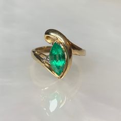 Vintage Emerald Ring, Emerald Diamond Ring, Pear Shaped Emerald Ring, Emerald Jewelry, Emerald Rings For Women, Gemstone Engagement Ring A whimsical vintage twirled solid gold ring featuring a colombian emerald weighing 1.37 carats accented by a single round diamond weighing 0.04 carats set in solid 14k yellow gold. *Ring size: US 6.5 *Complimentary resizing is available up to 3 sizes larger or smaller than stated size. Classic Green Marquise Rings, 14k Gold Turquoise Ring For Anniversary, Green Marquise 14k Gold Ring, Heirloom Emerald Marquise Rings, Green Marquise Ring In 14k Gold, Marquise Green Ring In 14k Gold, Heirloom Marquise Emerald Ring In 14k Gold, Green Pear-shaped 14k Gold Rings, Fine Jewelry Turquoise Open Ring For Anniversary