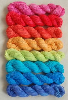 six skeins of yarn in different colors