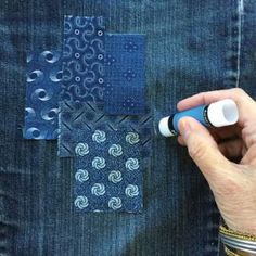 a person is using a marker to draw on the back pocket of a pair of jeans