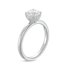 a white gold engagement ring with an oval cut diamond