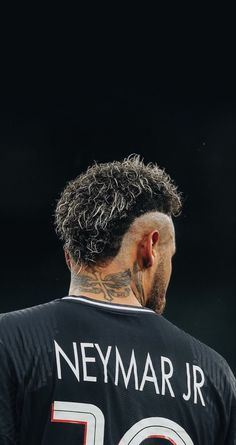 the back of a man's head with tattoos on his face and neck, wearing a jersey that says neymar jr