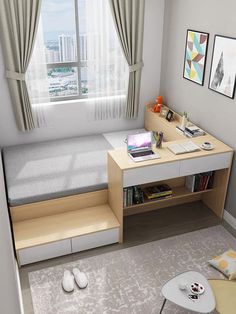 a bedroom with a bed, desk and computer on the table in front of a window