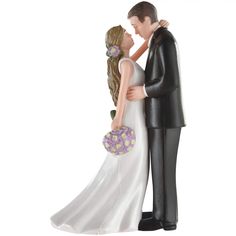 a bride and groom figurine holding each other