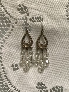 Hippie boho earrings 80s disco style Silver tone tear drop earrings with crystals hanging and fish hook will makes excellent gift for Vintage lovers and also will add some sparkle to your look  2.5 inches length with hook  Good  vintage condition  Great statement piece for coordinated outfit! Crystals Hanging, 80s Disco, Disco Style, Crystals Earrings, Jewelry Hippie, Vintage Lovers, Vintage Lover, Earrings Vintage, Tear Drop