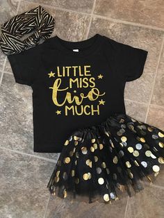 a little miss two much shirt and black tutu skirt with gold polka dots on it