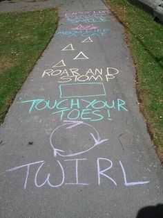 chalk writing on the sidewalk in front of a house that says, touhour toest turl