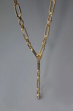 The Elevated Y Chain Necklace features a 17" chain with 4" link drop, Y link charm measuring 4", 3" ball chain ext, lobster claw clasp, and gold plated metal finish. This product is lead and nickel compliant and is coated with anti-tarnish double E-coating for extra protection. Gold Oval Link Chain Charm Necklace, Gold Charm Necklace With Oval Link Chain, Gold-tone Dangle Charm Necklaces, Gold Link Charm Necklace, Adjustable Gold Plated Chain Link Necklace, Gold Metal Link Charm Necklace, Gold Plated Gold Chain Charm Necklace, Gold Metal Link Charm Necklaces, Gold Plated Charm Necklace With Adjustable Chain