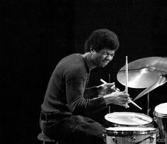 a man is playing the drums on stage