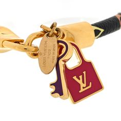 This is an authentic LOUIS VUITTON Monogram Multicolor Luck It Bracelet size 17 in Black. This bracelet is crafted of Louis Vuitton multicolore monogram coated canvas, with brass D-ring clasp ends. The bracelet features both a lock and a key charm in pink and purple resin. Purple Resin, 17 Black, Pink And Purple, D Ring, Bracelet Sizes, Authentic Louis Vuitton, Louis Vuitton Monogram, Monogram, Louis Vuitton