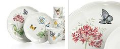 a plate with flowers and butterflies painted on it, next to a set of dishes