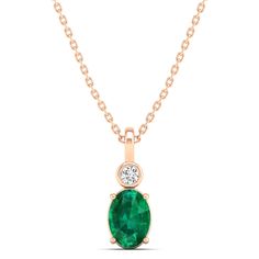 This exquisite oval-shaped emerald pendant is a true statement piece, exuding elegance and sophistication. Crafted with precision and attention to detail, the emerald is surrounded by sparkling diamonds, adding a touch of luxury to the design. Metal: 14K Gold Setting Type: Prong Rhodium Finish: Yes, on White Gold Gemstone Details: Gemstone: Emerald Shape: Oval Average Dimensions: 7.00 x 5.00 MM Quantity: 01 Average Cut: Very Good Average Color: Medium to Dark Green Average Clarity: Eye Clean Nat Elegant Oval Emerald Pendant Necklace, Elegant Oval Pendant Emerald Necklace, Elegant Oval Emerald Necklace With Bezel Setting, Elegant Oval Emerald Necklace For May Birthstone, Oval Emerald Necklace With Diamond Accents, Oval Green Emerald Necklace With Diamond Accents, Elegant Emerald Oval Pendant Necklace, Formal Oval Pendant Emerald Birthstone Necklace, Formal Emerald Oval Pendant Birthstone Necklace