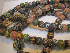 This is another post for North African Trade beads that was acquired by a Native American Jewelry Designer here in the Pacific Northwest (Lot more to come). These are From Ghana and are very colorful handmade glass beads from scraps and glass bottles fired in a clay molds. They are strung on Rafia and there are over 120 beads included in both of these strands, think of all the wonderful jewelry you could make with these. Clay Molds, African Trade Beads, Handmade Glass Beads, Molding Clay, Trade Beads, The Pacific Northwest, Jewelry Designer, A Plus, American Jewelry