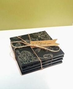 a stack of black and white cards tied with twine