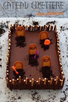 there is a cake with dirt and carrots on the top that says happy halloween