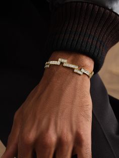 If you’ve ever played Tetris, KOLOURS JEWELRY’s bracelet will look familiar, the cubic links are arranged to resemble the ‘Tetrominos’ in the game. It’s made from 18-karat gold that’s polished to a high shine and set with baguette-cut diamonds. Gold Tennis Bracelet With Rectangular Diamond Links, Gold Diamond Tennis Bracelet With Rectangular Links, Modern Gold Diamond Tennis Bracelet, Modern Diamond Tennis Bracelet In Gold, Gold Baguette Cut Diamond Bracelet With Jubilee Bracelet, Modern Gold Bracelet With Baguette Cut, Modern Gold Bracelets With Baguette Cut, Gold Baguette Diamond Bracelet, Modern Gold Baguette-cut Bracelet