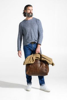 Built for hassle-free globetrotting, the Booker Cabin Duffel effortlessly combines form and function for the business or pleasure traveler. Carry solo for an efficient overnight or pair it with any of Moore & Giles' carry-on suitcases for longer excursions. To make traveling simpler, the Booker slips over the handle of the Parker rolling suitcase while separate exterior pockets keep both your laptop and toiletries easily accessible. About Baldwin Oak Leather Tanned in Italy on heavier weight Eur Luxury Casual Leather Travel Bag, Leather Duffel, Carry On Suitcase, Bag Icon, Handcrafted Leather, Travel Companion, Suitcases, Rustic Elegance, Carry On