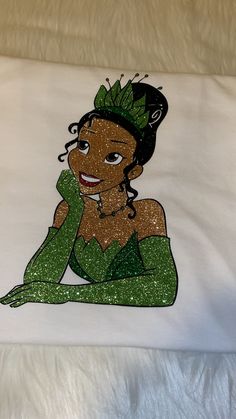 a t - shirt with an image of a princess sitting on the floor and smiling