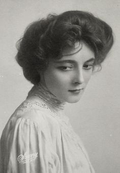 an old black and white photo of a woman