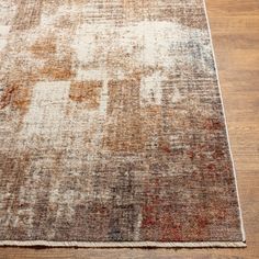 an area rug is shown on the floor with wood floors and hardwooding in the background