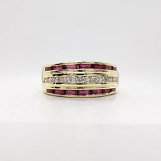 14K Yellow Gold 1/4 TCW Diamonds & 1.0 TCW Rubies Wide Band Ring Size 7.5 *Item Details* Diamonds Quality: SI Ring Size 7.5 Ring Weight Approx. 5.8g Approx. Diamond Carat Weight: 0.25 TCW Approx. Ruby Carat Weight: 0.95 TCW The ring has been refinished by a professional Jeweler to look brand new. All diamonds are natural, genuine, and have been tested. Black Felt Ring Box Included SOLD AS IS *Shipping Info* FREE SHIPPING A signature upon delivery is required Returns are accepted within 14 days o Red Diamond Rings With Channel Set, Red Diamond Channel Set Rings, Yellow Gold Ruby Ring With Channel Set Diamonds, Ruby Ring With Channel Set Diamonds In Yellow Gold, Yellow Gold Ruby Ring With Channel Setting For Anniversary, Anniversary Ruby Ring In Yellow Gold With Channel Set, Anniversary Yellow Gold Ruby Ring Channel Set, Luxury Diamond Channel Set Ruby Ring, Red Channel Set Round Jewelry