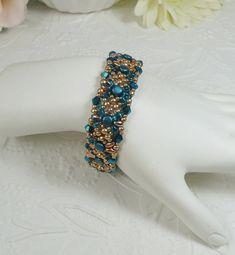 Woven Bracelet in Dark Aqua and Gold Super Duo Beads with Crystals Handmade Gold Crystal Beaded Bracelets, Turquoise Beaded Crystal Bracelet For Party, Handmade Turquoise Crystal Bracelet For Party, Aqua And Gold, Super Duo Beads, Dark Aqua, Duo Beads, Super Duo, Woven Bracelet