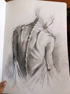 a drawing of a man's back in charcoal pencil