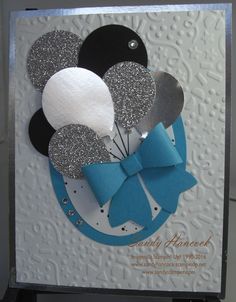 a close up of a greeting card with balloons